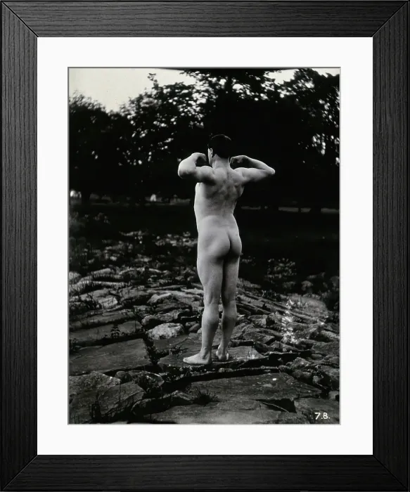 Framed Print : A man posing naked, with his back to the camera, standing on a rocky outcrop, c1900. Creator: Unknown Framed Print : A man posing naked, with his back to the camera, standing on a rocky outcrop, c1900. Creator: Unknown