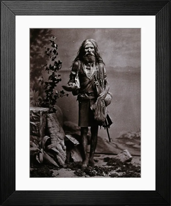 Framed Print : An Indian man wearing many beads, and carrying a begging bowl and an umbrella, in a... c1900. Creator: Unknown Framed Print : An Indian man wearing many beads, and carrying a begging bowl and an umbrella, in a... c1900. Creator: Unknown