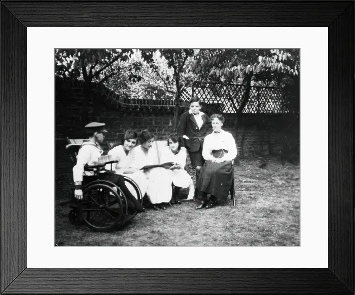 Framed Print : A physically disabled boy sitting in a wheelchair in a garden, c1910 / 1925. Creator: Unknown Framed Print : A physically disabled boy sitting in a wheelchair in a garden, c1910 / 1925. Creator: Unknown