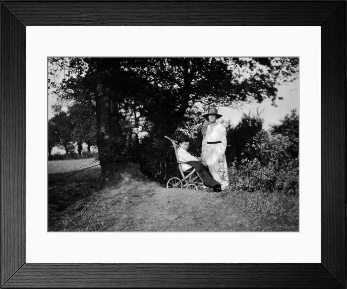 Framed Print : A physically disabled boy sitting in a wheelchair, c1910 / 1925. Creator: Unknown Framed Print : A physically disabled boy sitting in a wheelchair, c1910 / 1925. Creator: Unknown