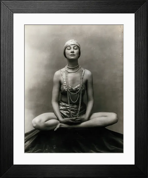 Framed Print : Marguerite Agniel posing with her legs crossed and hands together resting on her legs, 1929. Creator: Unknown