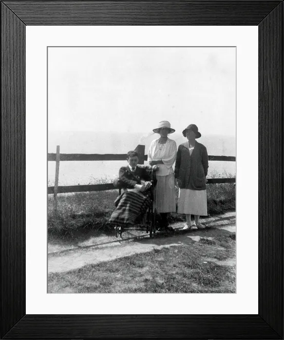 Framed Print : A physically disabled boy sitting in a wheelchair, c1910 / 1925. Creator: Unknown Framed Print : A physically disabled boy sitting in a wheelchair, c1910 / 1925. Creator: Unknown