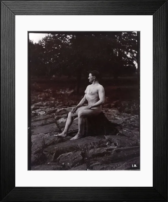 Framed Print : A man posing naked, seated on a rocky outcrop in a leafy landscape, c1900. Creator: Unknown Framed Print : A man posing naked, seated on a rocky outcrop in a leafy landscape, c1900. Creator: Unknown