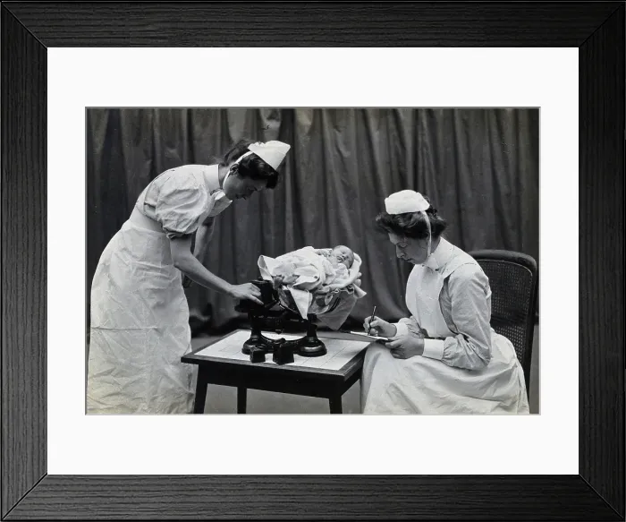 Framed Print : General Lying In Hospital, York Road, Lambeth: nurses weighing a baby, 1906 Creator: Unknown Framed Print : General Lying In Hospital, York Road, Lambeth: nurses weighing a baby, 1906 Creator: Unknown