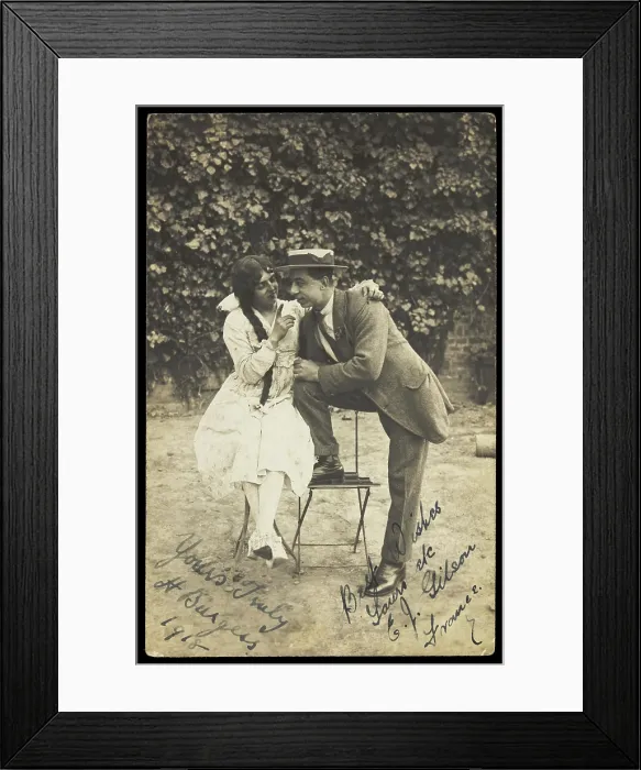 Framed Print : Two actors, one in drag, pose on garden furniture, 1918. Creator: Unknown Framed Print : Two actors, one in drag, pose on garden furniture, 1918. Creator: Unknown