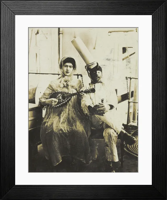 Framed Print : Two sailors (?) on board ship: one in drag is playing a guitar, 1907. Creator: Unknown Framed Print : Two sailors (?) on board ship: one in drag is playing a guitar, 1907. Creator: Unknown