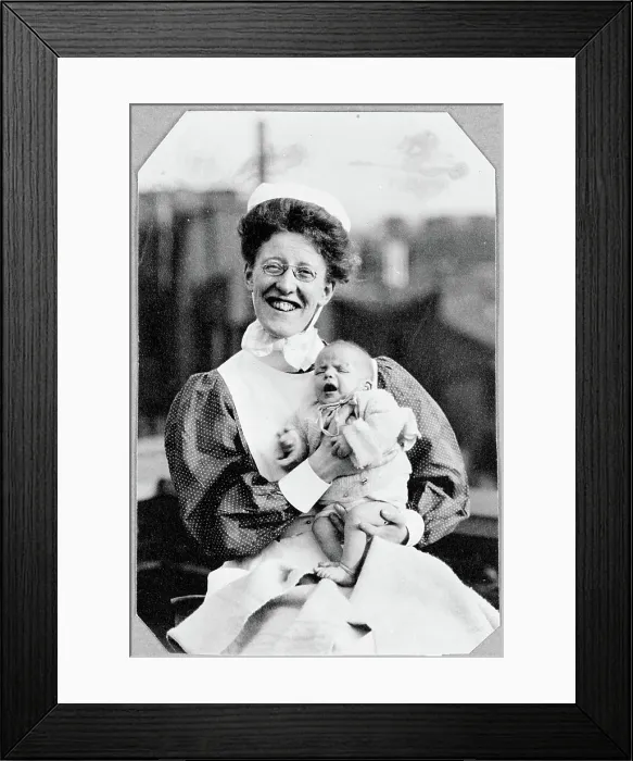 Framed Print : General Lying In Hospital, York Road, Lambeth: nurse sitting holding baby, 1906. Creator: Unknown Framed Print : General Lying In Hospital, York Road, Lambeth: nurse sitting holding baby, 1906. Creator: Unknown