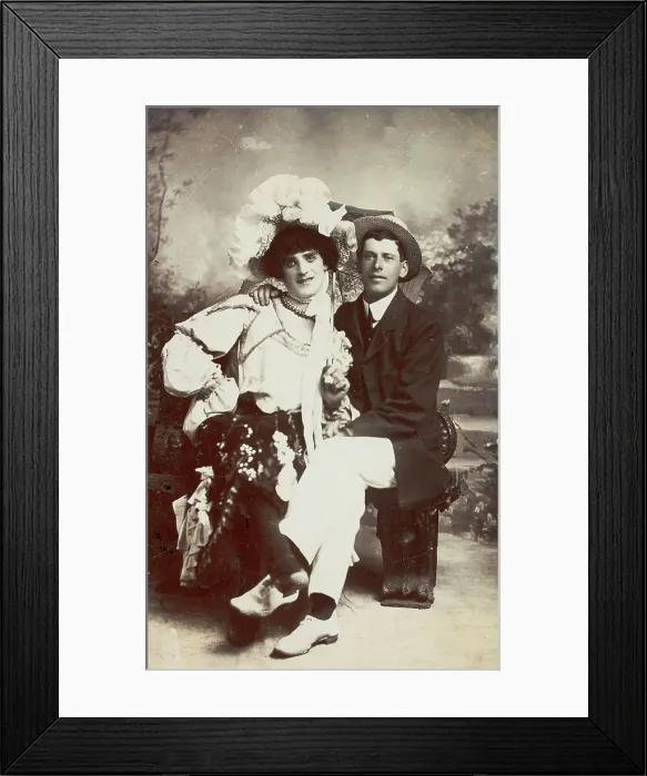 Framed Print : Two men, one in drag, sit together on a bench, (between 1900 and 1901?). Creator: Unknown Framed Print : Two men, one in drag, sit together on a bench, (between 1900 and 1901?). Creator: Unknown