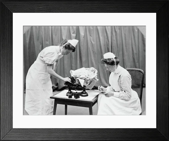 Framed Print : General Lying In Hospital, York Road, Lambeth: nurses weighing a baby, 1908. Creator: Unknown Framed Print : General Lying In Hospital, York Road, Lambeth: nurses weighing a baby, 1908. Creator: Unknown