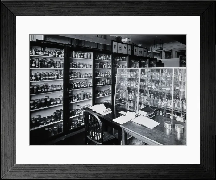Framed Print : The Wellcome Building, Euston Road, London: working area in the materia medica stores, c1930s.. Creator: Unknown Framed Print : The Wellcome Building, Euston Road, London: working area in the materia medica stores, c1930s.. Creator: Unknown