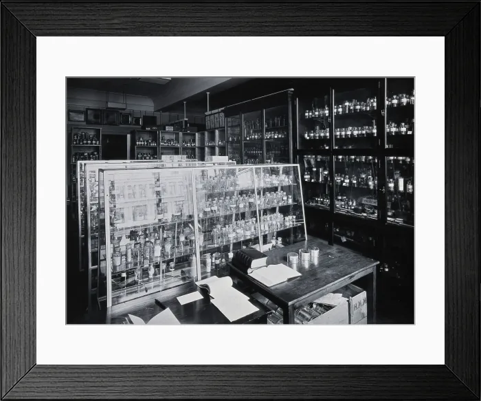 Framed Print : The Wellcome Building, Euston Road, London: working area in the materia medica stores, c1910s. Creator: Unknown Framed Print : The Wellcome Building, Euston Road, London: working area in the materia medica stores, c1910s. Creator: Unknown