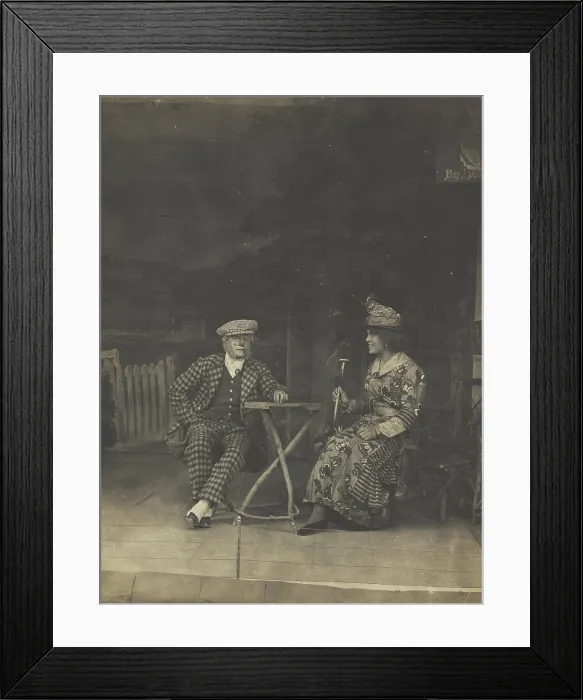 Framed Print : Two sailors, one in drag, sit on stage at a table, in front of very detailed scenery (1910-1919?). Creator: Unknown Framed Print : Two sailors, one in drag, sit on stage at a table, in front of very detailed scenery (1910-1919?). Creator: Unknown
