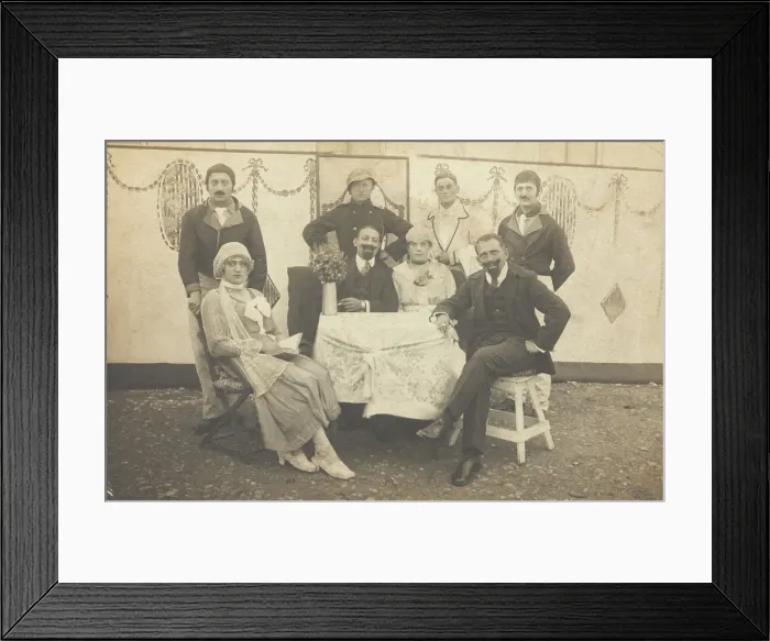 Framed Print : German soldiers, some in drag, pose round a table at a concert party, (between 1910 and 1919?). Creator: Unknown Framed Print : German soldiers, some in drag, pose round a table at a concert party, (between 1910 and 1919?). Creator: Unknown