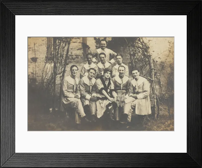 Framed Print : Concert party performers, one in drag, pose for a group portrait, (between 1910 and 1919?). Creator: Unknown Framed Print : Concert party performers, one in drag, pose for a group portrait, (between 1910 and 1919?). Creator: Unknown