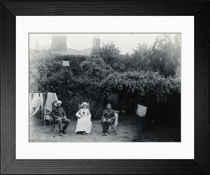 Framed Print : Holmleigh Auxiliary Military Hospital, Harrow: a nurse and two soldiers, one of whom has... c1922. Creator: Unknown Framed Print : Holmleigh Auxiliary Military Hospital, Harrow: a nurse and two soldiers, one of whom has... c1922. Creator: Unknown