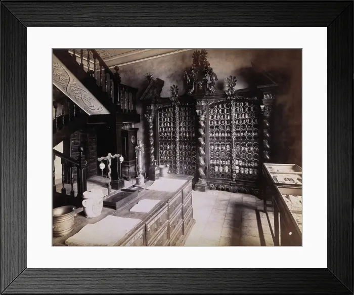 Framed Print : An eighteenth-century apothecary's shop with intricately carved wooden showcases; recreated Framed Print : An eighteenth-century apothecary's shop with intricately carved wooden showcases; recreated