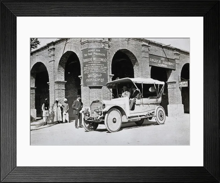 Framed Print : Two men in a car outside the Wellcome pharmaceutical depot in the Middle East, c1900s. Creator: Unknown Framed Print : Two men in a car outside the Wellcome pharmaceutical depot in the Middle East, c1900s. Creator: Unknown