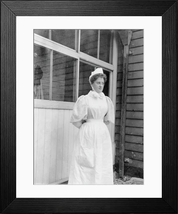 Framed Print : Nurse standing outside an isolation hospital, possibly at Ilford, Essex. Creator: Unknown Framed Print : Nurse standing outside an isolation hospital, possibly at Ilford, Essex. Creator: Unknown