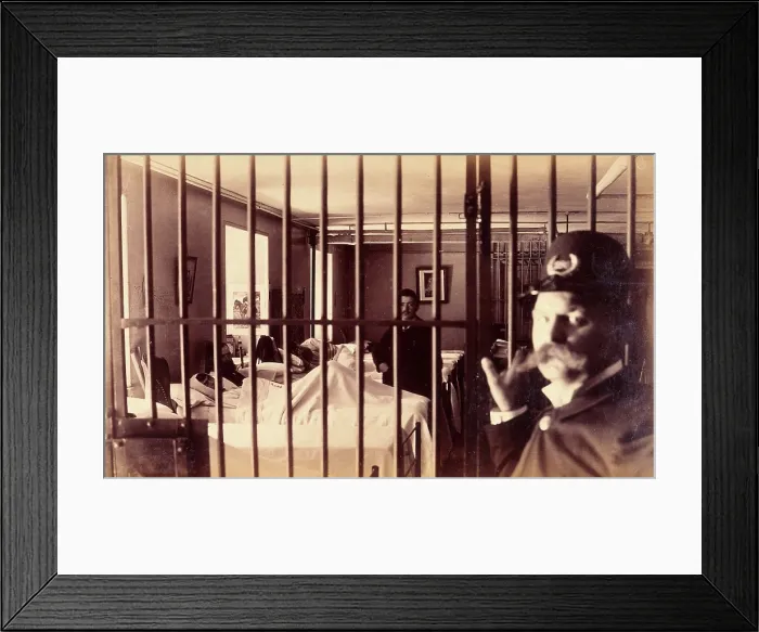 Framed Print : Bellevue Hospital, New York City: male patients (criminal insane?) in bed in ward, prison bars in... Creator: Unknown Framed Print : Bellevue Hospital, New York City: male patients (criminal insane?) in bed in ward, prison bars in... Creator: Unknown