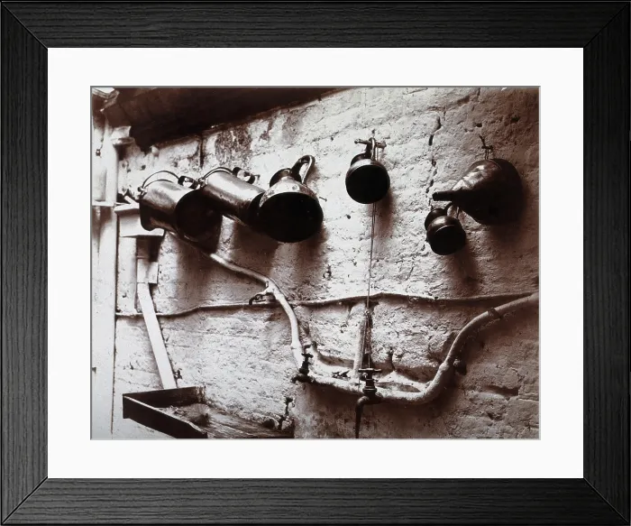 Framed Print : Measuring jugs and a funnel hung on a wall in the Red Cross pharmacy in London, c1890s. Creator: Unknown Framed Print : Measuring jugs and a funnel hung on a wall in the Red Cross pharmacy in London, c1890s. Creator: Unknown