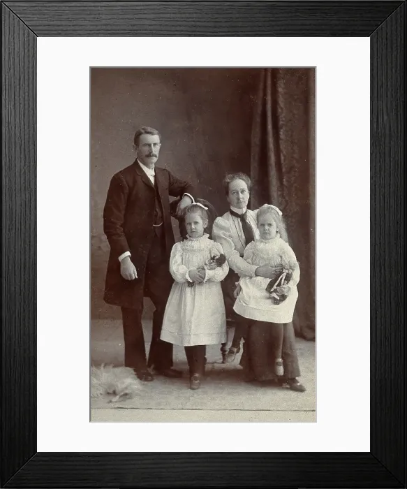 Framed Print : Unidentified family with two girls holding dolls. Creator: Priyalalls Photography Framed Print : Unidentified family with two girls holding dolls. Creator: Priyalalls Photography