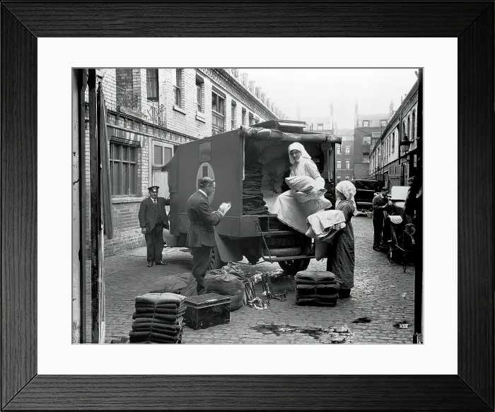 Framed Print : Ambulance Column depot, 9 Gower Street, London: loading up the blanket bus in Gower Mews, 1918. Creator: Unknown Framed Print : Ambulance Column depot, 9 Gower Street, London: loading up the blanket bus in Gower Mews, 1918. Creator: Unknown