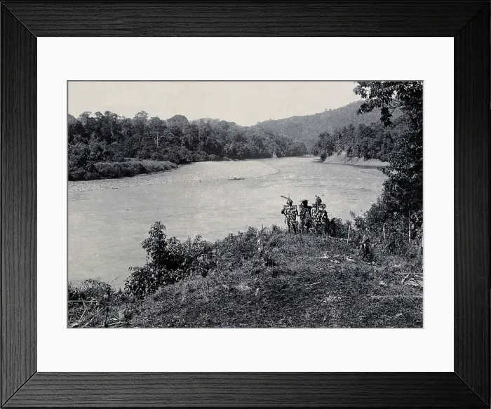 Framed Print : Sarawak: three men standing by the Baram River, c1900. Creator: Unknown Framed Print : Sarawak: three men standing by the Baram River, c1900. Creator: Unknown