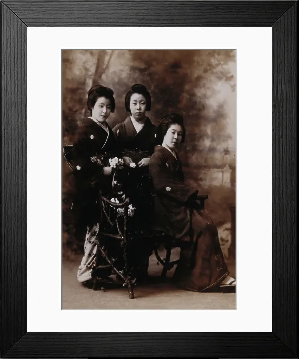 Framed Print : Three young women posing in a photographic studio, one seated on a bench... early 20th century. Creator: Unknown Framed Print : Three young women posing in a photographic studio, one seated on a bench... early 20th century. Creator: Unknown