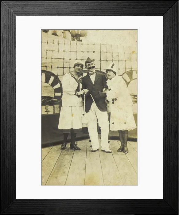 Framed Print : Three sailors, two in drag wearing pierrette costumes, pose on deck, c1910s. Creator: Unknown Framed Print : Three sailors, two in drag wearing pierrette costumes, pose on deck, c1910s. Creator: Unknown
