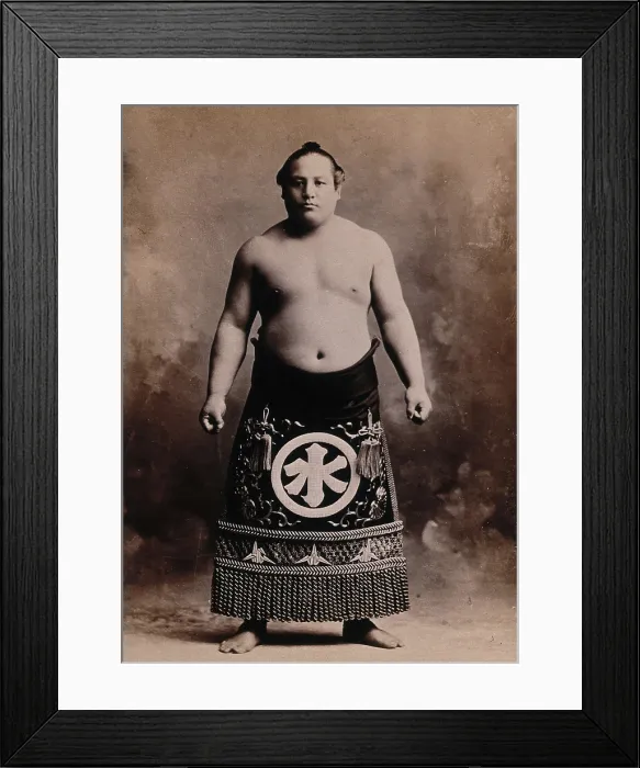 Framed Print : A young sumo wrestler posing in a photographic studio, wearing a richly decorated apron... c1900. Creator: Unknown Framed Print : A young sumo wrestler posing in a photographic studio, wearing a richly decorated apron... c1900. Creator: Unknown