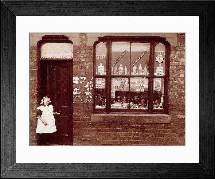 Framed Print : A grocer's shop in England: doorway and shop window, (1900?). Creator: Unknown. A grocer's shop in England: doorway and shop window, (1900?). Creator: Unknown Framed Print : A grocer's shop in England: doorway and shop window, (1900?). Creator: Unknown. A grocer's shop in England: doorway and shop window, (1900?). Creator: Unknown