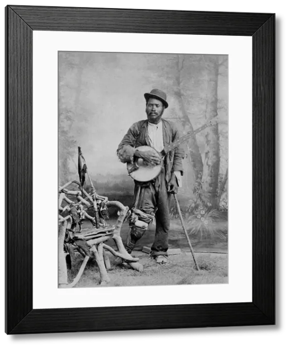 Framed Print : A black banjo player with a wooden leg, c1865. Creator: Unknown Framed Print : A black banjo player with a wooden leg, c1865. Creator: Unknown