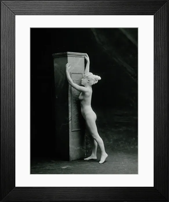 Framed Print : A young woman, posing naked in a classical attitude, against a square column... c1890 / 1910. Creator: Unknown Framed Print : A young woman, posing naked in a classical attitude, against a square column... c1890 / 1910. Creator: Unknown