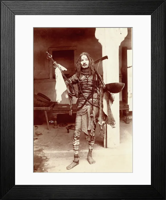Framed Print : A young Indian man wearing many beads and makeup in a temple precinct, c1900. Creator: Unknown Framed Print : A young Indian man wearing many beads and makeup in a temple precinct, c1900. Creator: Unknown
