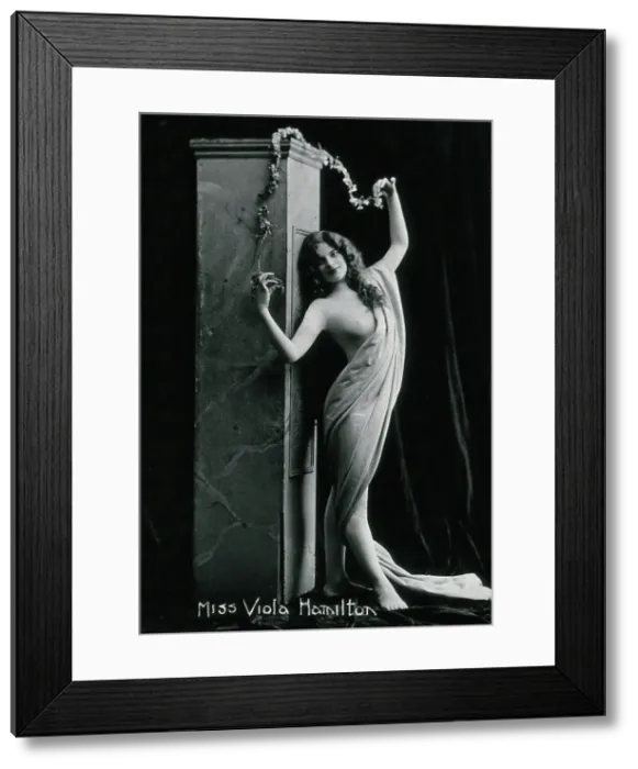 Framed Print : Viola Hamilton, posing in a classical attitude against a square column, early 20th century. Creator: Unknown Framed Print : Viola Hamilton, posing in a classical attitude against a square column, early 20th century. Creator: Unknown