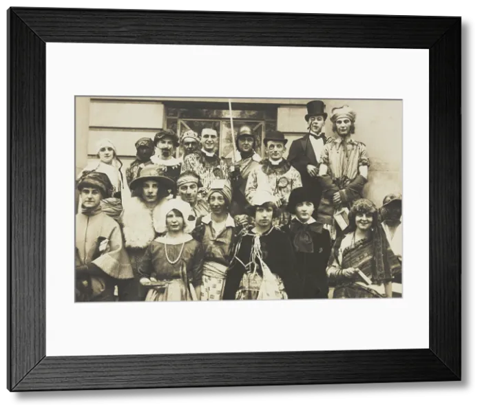 Framed Print : People gathered outside a building wearing various costumes, some in drag, 1924. Creator: Unknown Framed Print : People gathered outside a building wearing various costumes, some in drag, 1924. Creator: Unknown