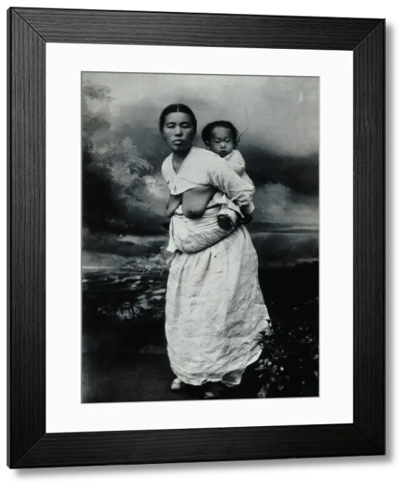 Framed Print : A Korean (?) woman, carrying a baby on her back, approx 1900. Creator: Unknown Framed Print : A Korean (?) woman, carrying a baby on her back, approx 1900. Creator: Unknown