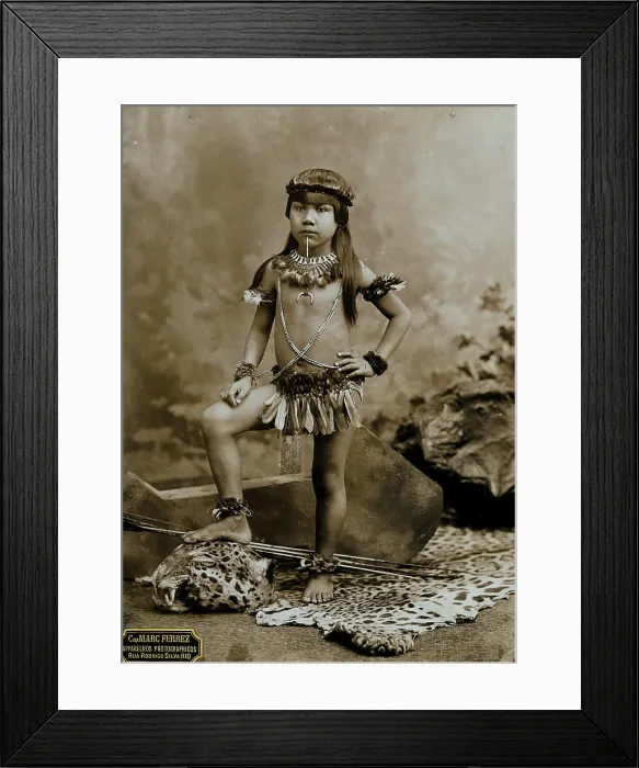 Framed Print : A child of an Amazonian Indian tribe, standing on a leopard skin, in a photographic studio, 1900. Creator: Unknown Framed Print : A child of an Amazonian Indian tribe, standing on a leopard skin, in a photographic studio, 1900. Creator: Unknown