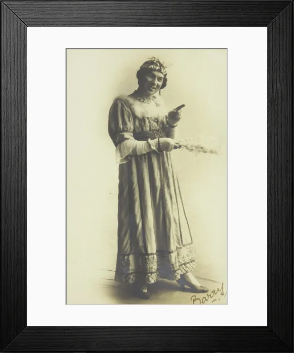 Framed Print : A man in drag, holding a feather, performing in the play A country girl, 1920 Framed Print : A man in drag, holding a feather, performing in the play A country girl, 1920