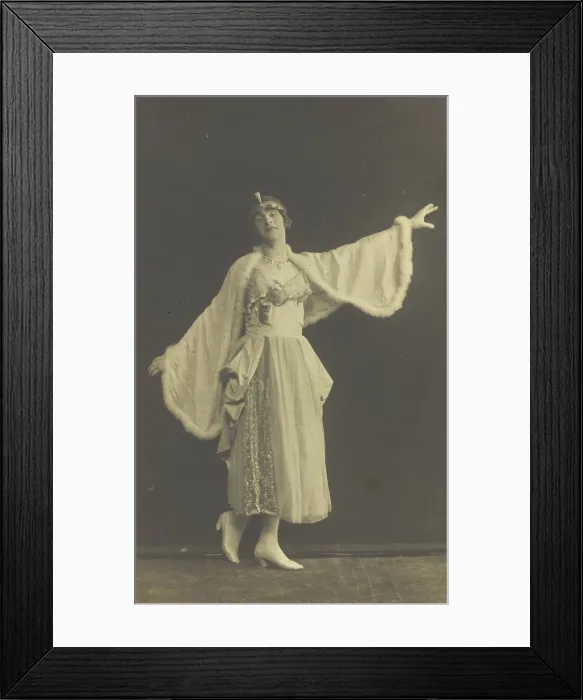 Framed Print : A prisoner of war in drag, wearing a dress and white cloak, poses...(between 1910 and 1919?). Creator: Albert Melzer Framed Print : A prisoner of war in drag, wearing a dress and white cloak, poses...(between 1910 and 1919?). Creator: Albert Melzer