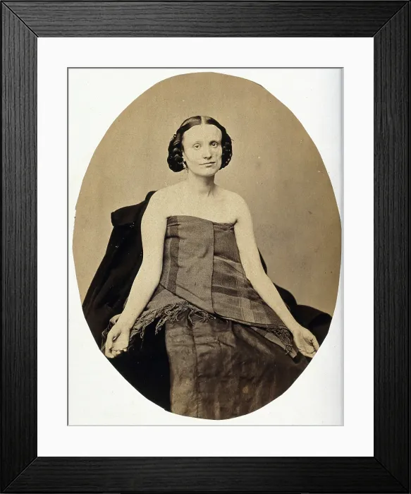 Framed Print : A woman seated; she is partially clothed with her arms extended and the left side of her... c1865. Creator: L. Haase & Company Framed Print : A woman seated; she is partially clothed with her arms extended and the left side of her... c1865. Creator: L. Haase & Company