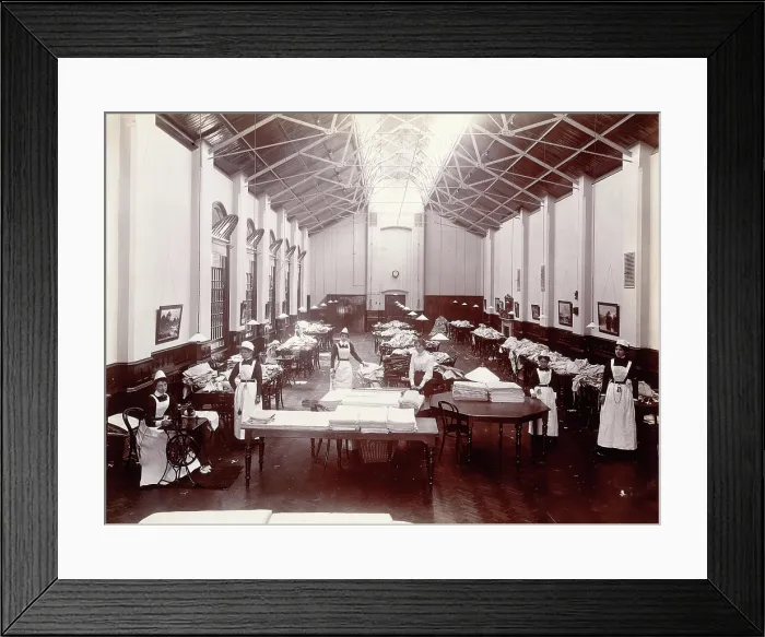 Framed Print : Claybury Asylum, Woodford, Essex: a linen room, [1893?]. Creator: London & County Photographic Co