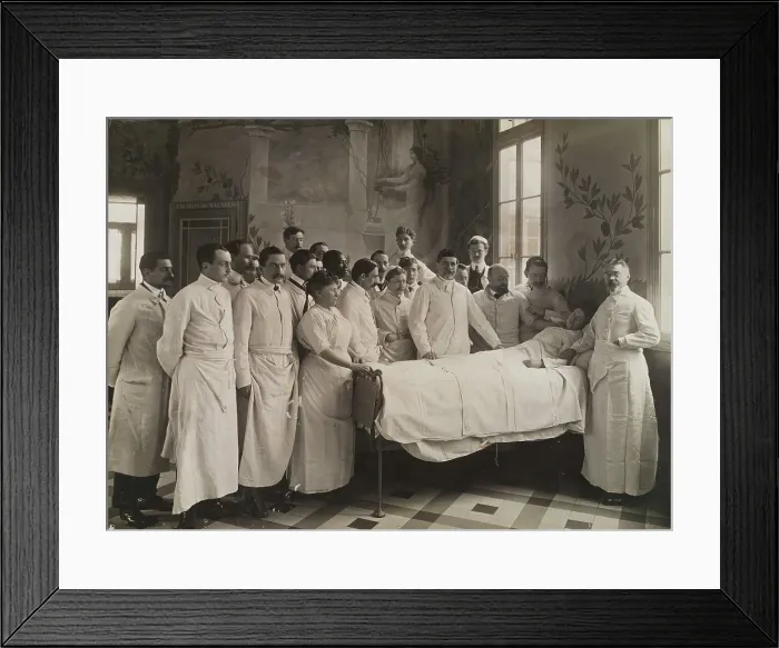 Framed Print : Medical staff standing round a woman patient in bed in a hospital ward, c1910. Creator: Freres Seeberger Framed Print : Medical staff standing round a woman patient in bed in a hospital ward, c1910. Creator: Freres Seeberger