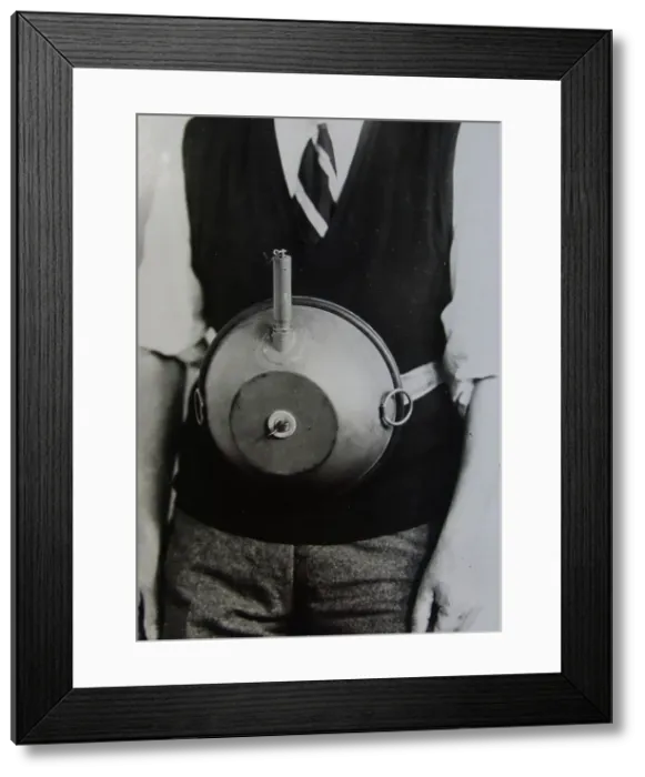 Framed Print : Cecil Vandepeer Clarke wearing an early version of the limpet mine on a keeper plate, c1939. Creator: British Government Framed Print : Cecil Vandepeer Clarke wearing an early version of the limpet mine on a keeper plate, c1939. Creator: British Government