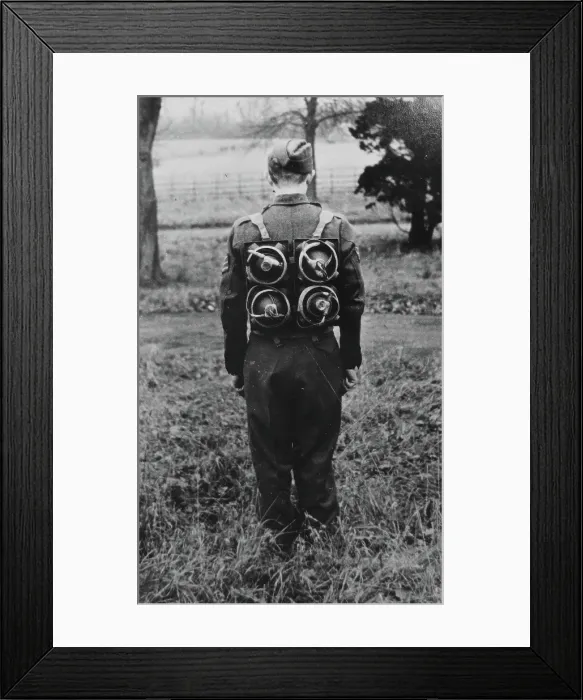 Framed Print : Limpet mines being carried on a harness on the back of a soldier, c1943. Creator: British Government Framed Print : Limpet mines being carried on a harness on the back of a soldier, c1943. Creator: British Government