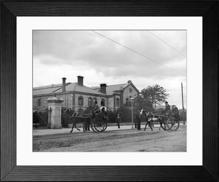 Framed Print : Street scene with horse carriages - possibly Ireland, 1898. Creator: Robert Augustus Henry L'Estrange. Street scene with horse carriages - possibly Ireland, 1898 Framed Print : Street scene with horse carriages - possibly Ireland, 1898. Creator: Robert Augustus Henry L'Estrange. Street scene with horse carriages - possibly Ireland, 1898