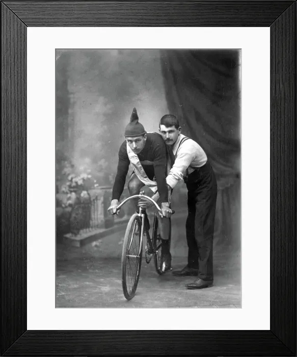 Framed Print : Unknown man on a bicycle, studio portrait (Championship of Queensland sash / ribbon), 1905 Framed Print : Unknown man on a bicycle, studio portrait (Championship of Queensland sash / ribbon), 1905