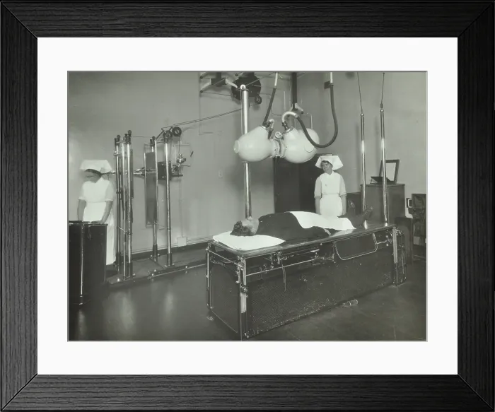 Framed Print : A patient undergoes a medical procedure, c1950s. Creator: Unknown Framed Print : A patient undergoes a medical procedure, c1950s. Creator: Unknown