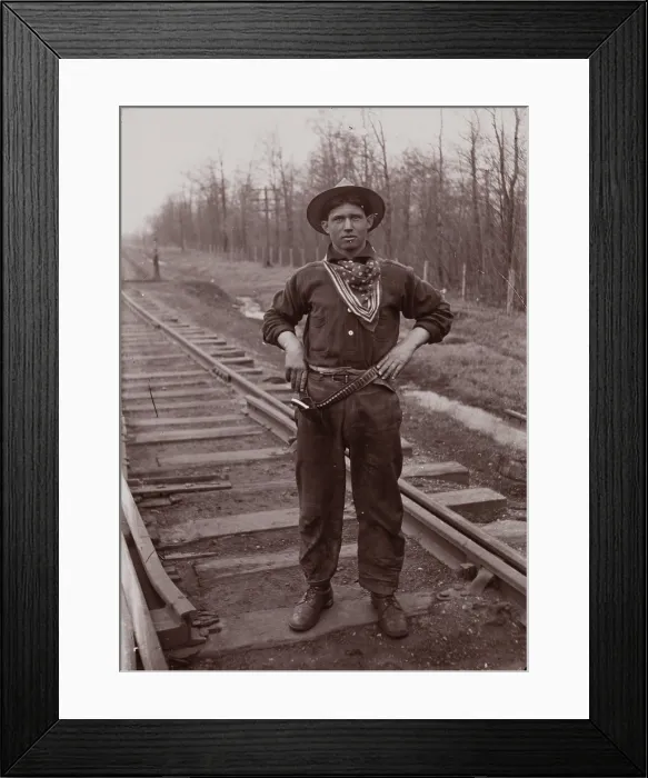 Framed Print : Untitled (man with pistol on railroad tracks, neg. #14), between 1910 and 1935, printed c1975. Creator: Wendell Hotter Framed Print : Untitled (man with pistol on railroad tracks, neg. #14), between 1910 and 1935, printed c1975. Creator: Wendell Hotter