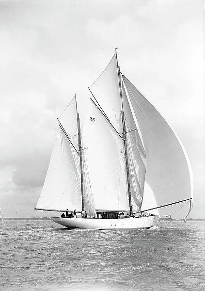 The 105 ft ketch Thendara sailing with spinnaker. 1939. Creator: Kirk & Sons of Cowes